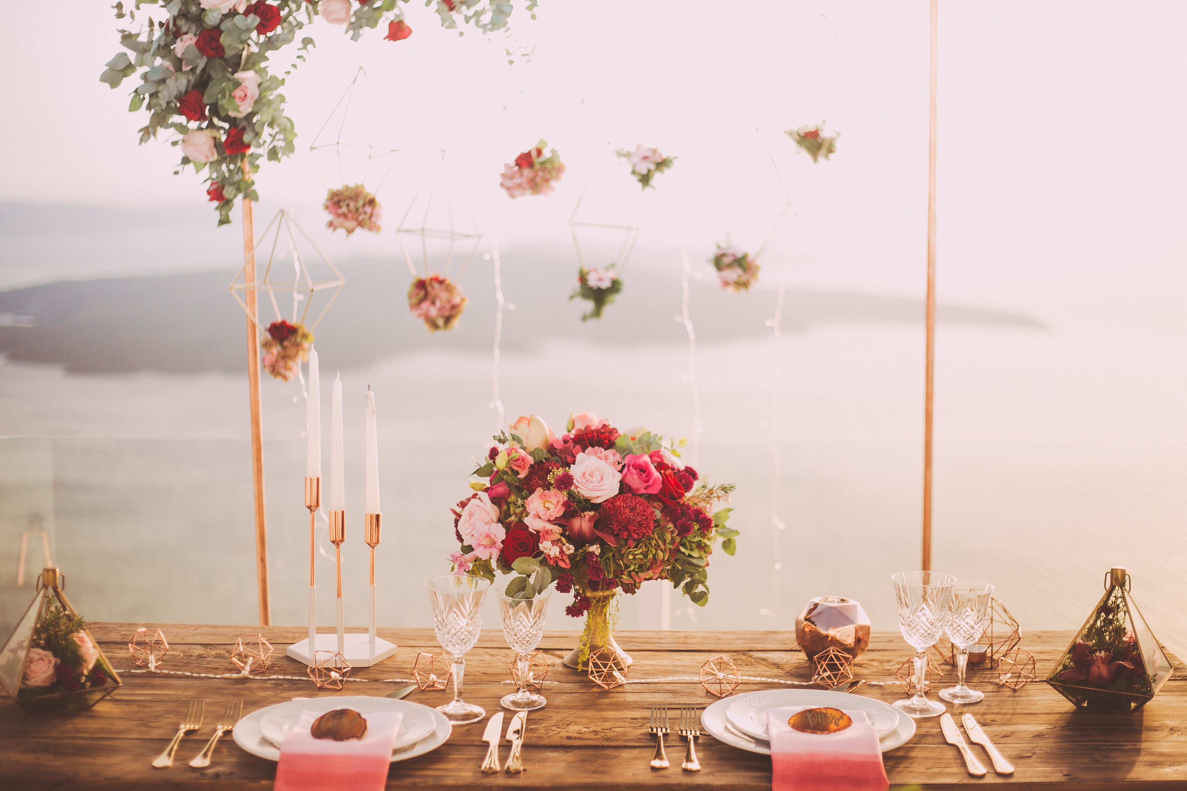 pink-and-red-roses-centerpiece-near-silverwares-1045541